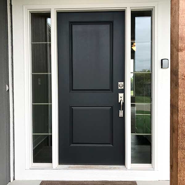 Black front door with wooden accent